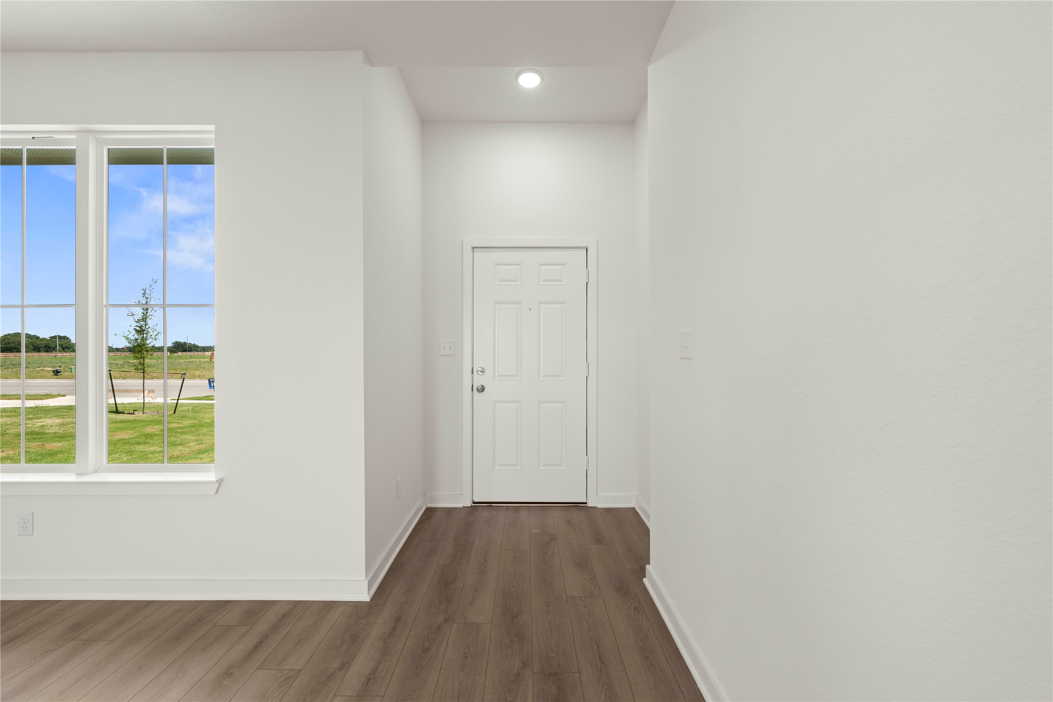 228 Gus Loop Georgetown, TX 78626 - Photo 4 of 19 A welcoming entry offers durable flooring and abundant natural light.