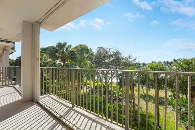 a balcony with a lake view