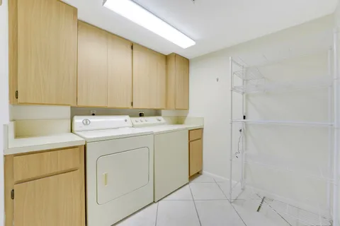 a utility room with a sink a washer and dryer