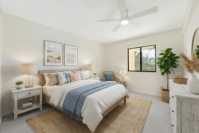 a bedroom with a large bed and a window