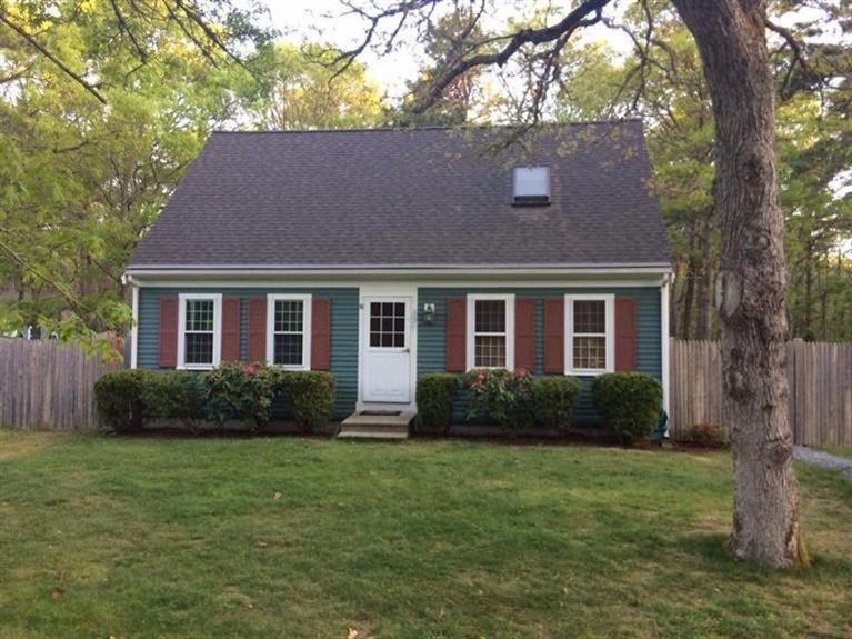63 Degrass Road Mashpee, MA 02649 - Photo 1 of 22 a front view of a house with garden