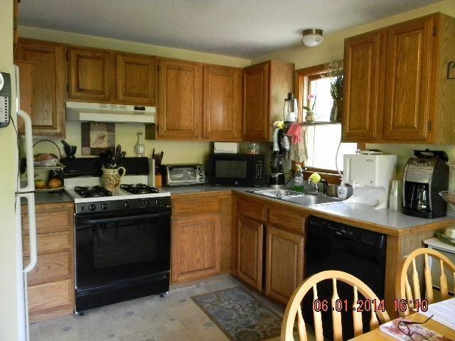 63 Degrass Road Mashpee, MA 02649 - Photo 3 of 22 a kitchen with a sink stove top oven and cabinets