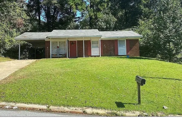 a front view of a house with a yard