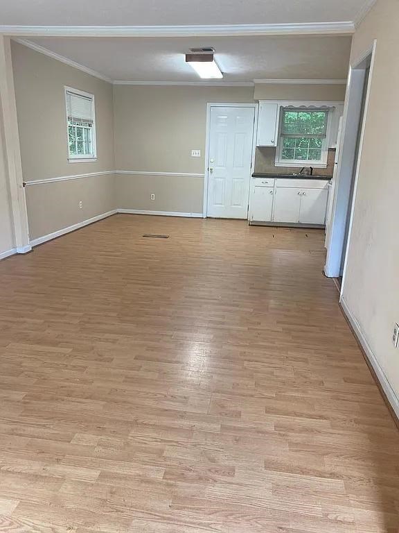 770 Andrea Drive Columbus, GA 31907 - Photo 2 of 5 a view of empty room with wooden floor and fan