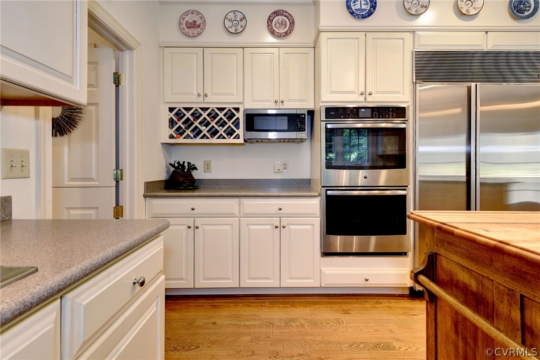 105 Mid Ocean Williamsburg, VA 23188 - Photo 13 of 36 a kitchen with stainless steel appliances granite countertop a refrigerator and a stove