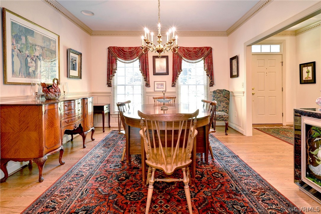 105 Mid Ocean Williamsburg, VA 23188 - Photo 14 of 36 a view of a dining room with furniture a chandelier and wooden floor
