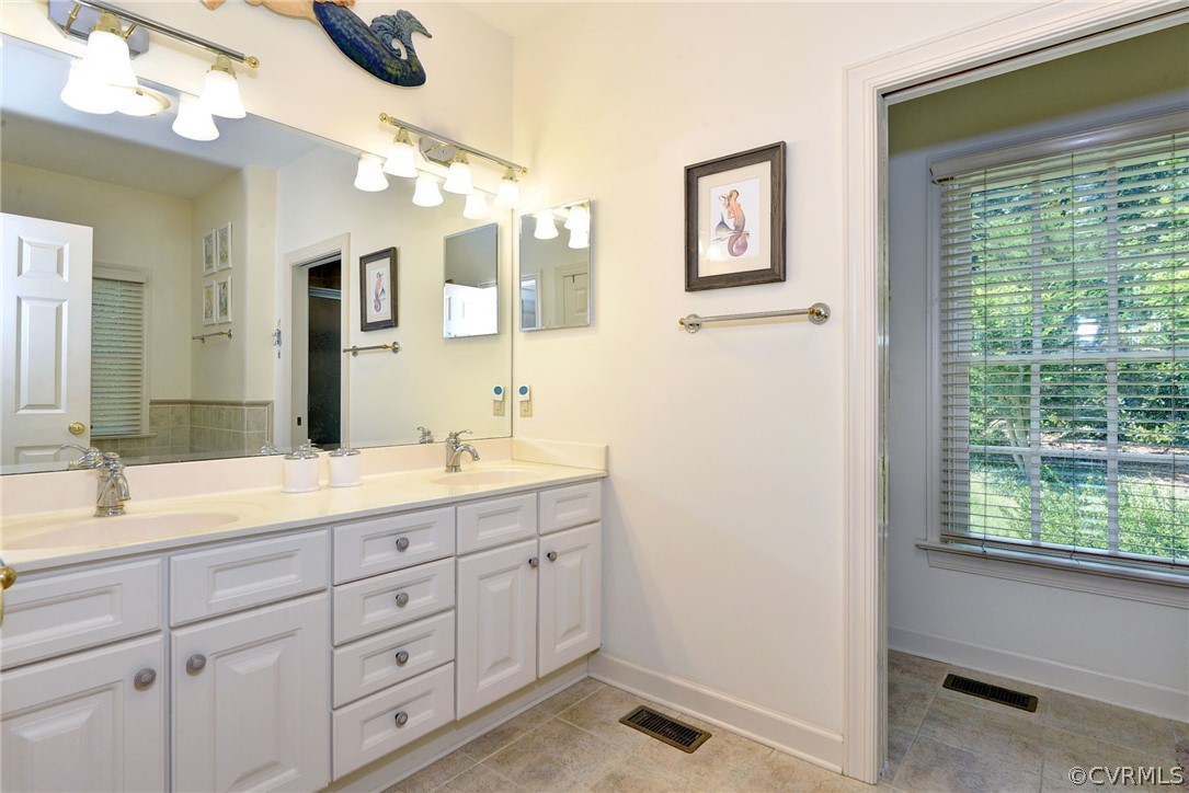 105 Mid Ocean Williamsburg, VA 23188 - Photo 19 of 36 a spacious bathroom with a double vanity sink a mirror and a shower