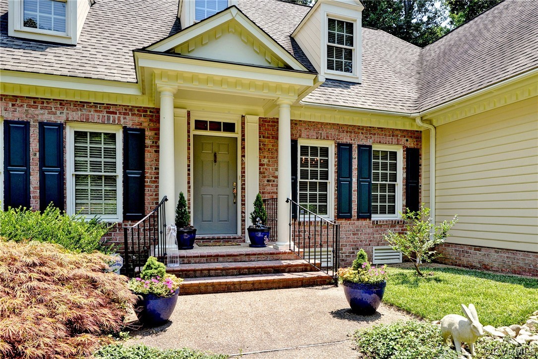 105 Mid Ocean Williamsburg, VA 23188 - Photo 2 of 36 a front view of a house with outdoor seating