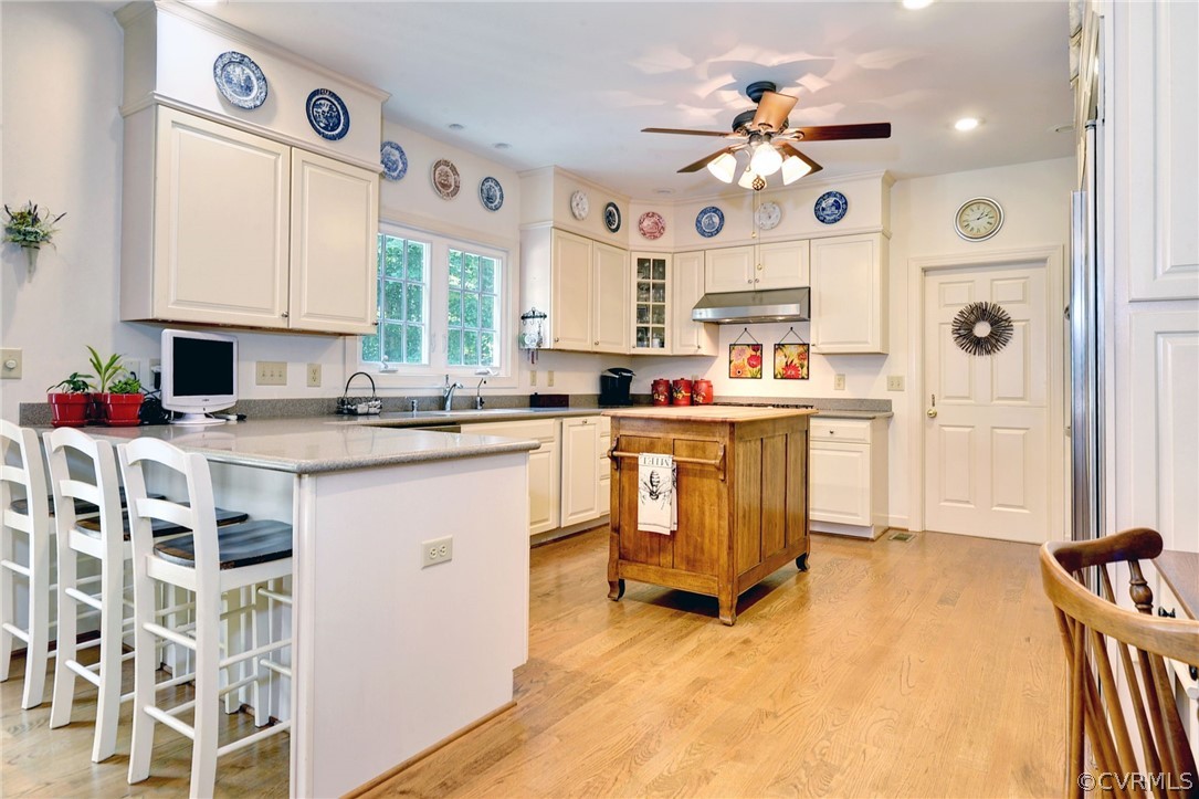 105 Mid Ocean Williamsburg, VA 23188 - Photo 9 of 36 a kitchen with a sink stove and cabinets
