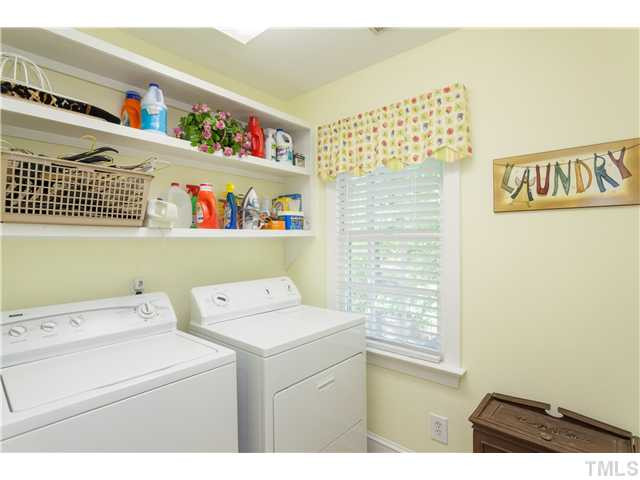 12405 Whartons Way Raleigh, NC 27613 - Photo 15 of 23 LARGE LAUNDRY ROOM WITH SHELVING.