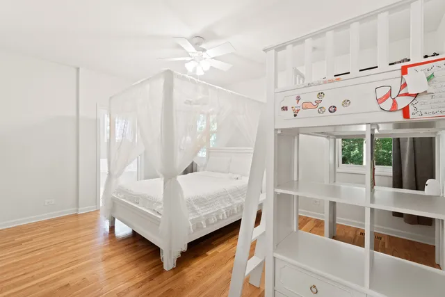a view of an entryway with wooden floor and front door