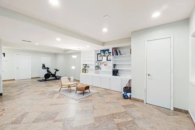 a bathroom with a sink vanity granite and shower
