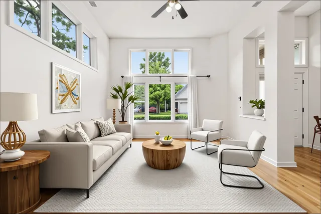 a living room with furniture and a large window