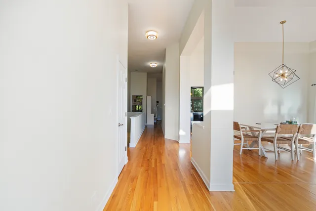 a view of a room with wooden floor