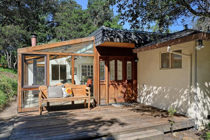 2915 Woodside Road Woodside, CA 94062 - Photo 3 of 17 a view of a dinning tables and chairs in patio of the house