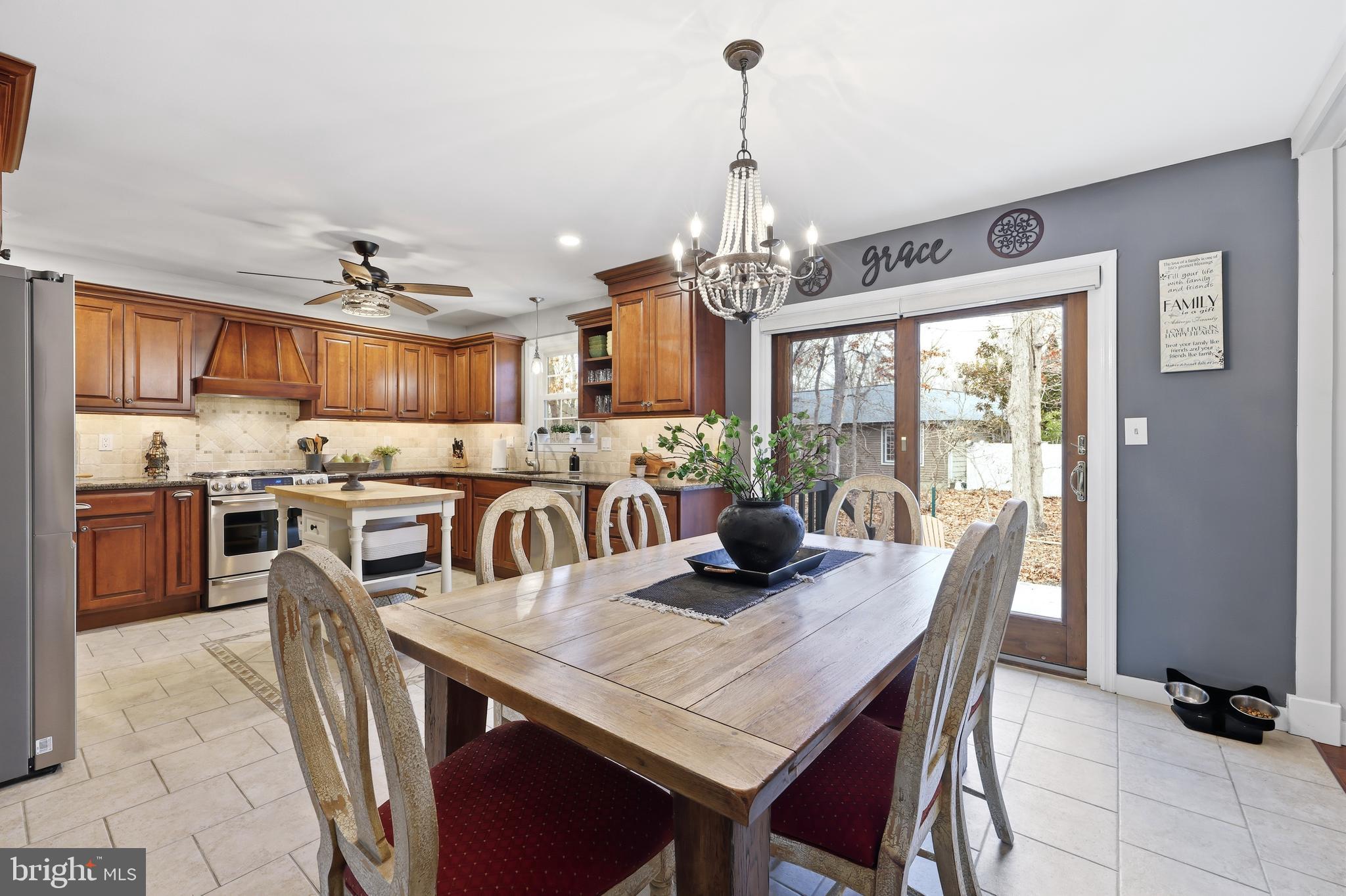 4 Prosit Lane Ocean View, NJ 08230 - Photo 11 of 29 a view of a dining room with furniture large window and wooden floor