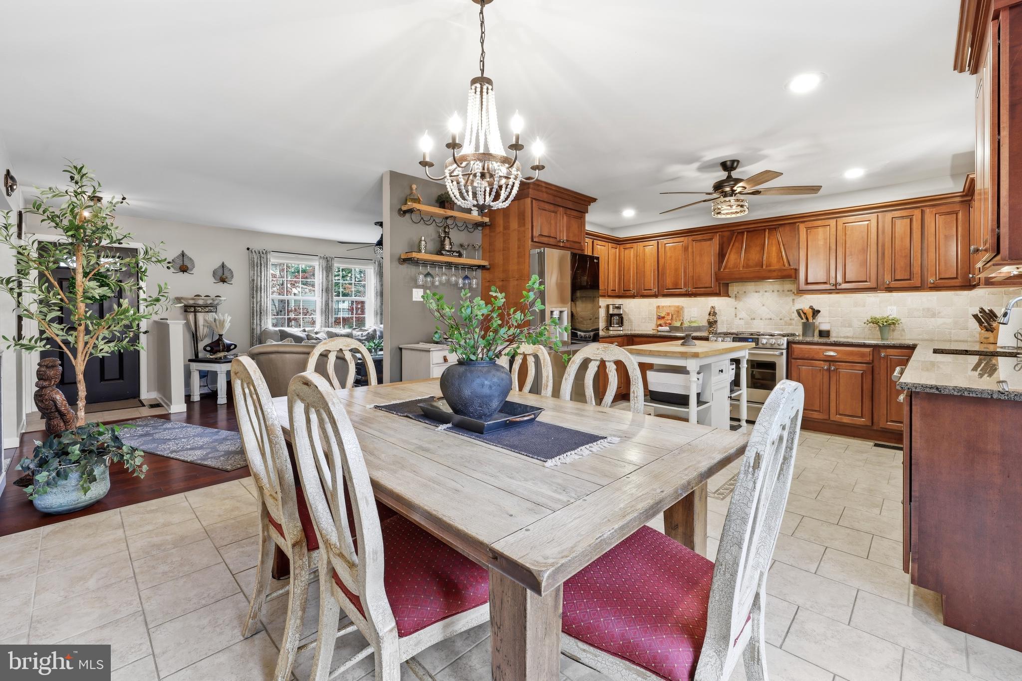 4 Prosit Lane Ocean View, NJ 08230 - Photo 12 of 29 a view of a dining room with furniture a chandelier and kitchen view