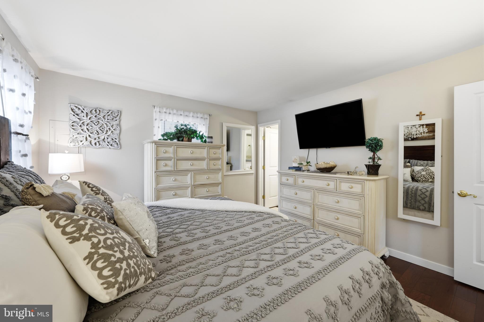 4 Prosit Lane Ocean View, NJ 08230 - Photo 20 of 29 a bedroom with a bed and flat screen tv