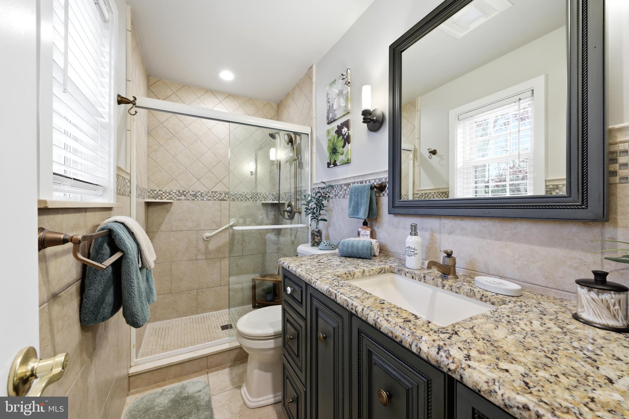 4 Prosit Lane Ocean View, NJ 08230 - Photo 21 of 29 a bathroom with a granite countertop sink toilet and shower