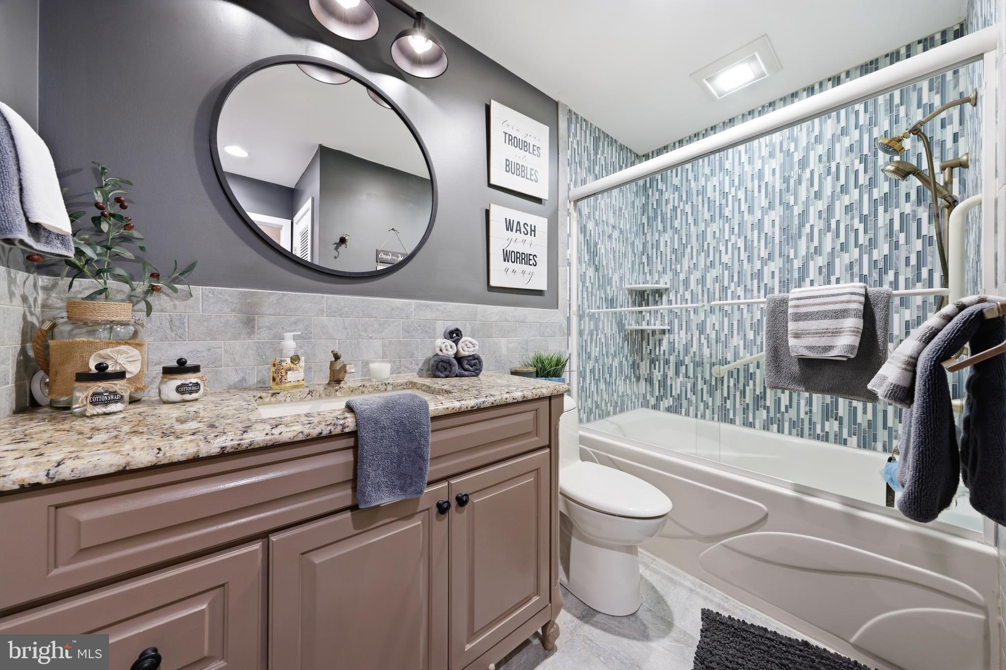 4 Prosit Lane Ocean View, NJ 08230 - Photo 24 of 29 a bathroom with a granite countertop sink mirror vanity and toilet
