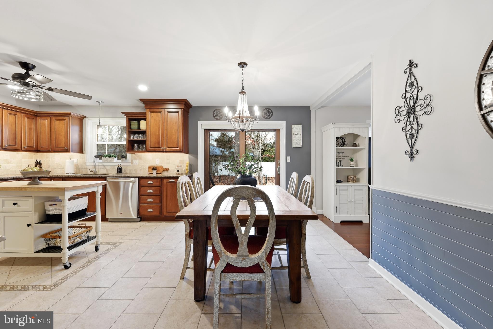 4 Prosit Lane Ocean View, NJ 08230 - Photo 10 of 29 a kitchen with kitchen island granite countertop a sink counter and chairs