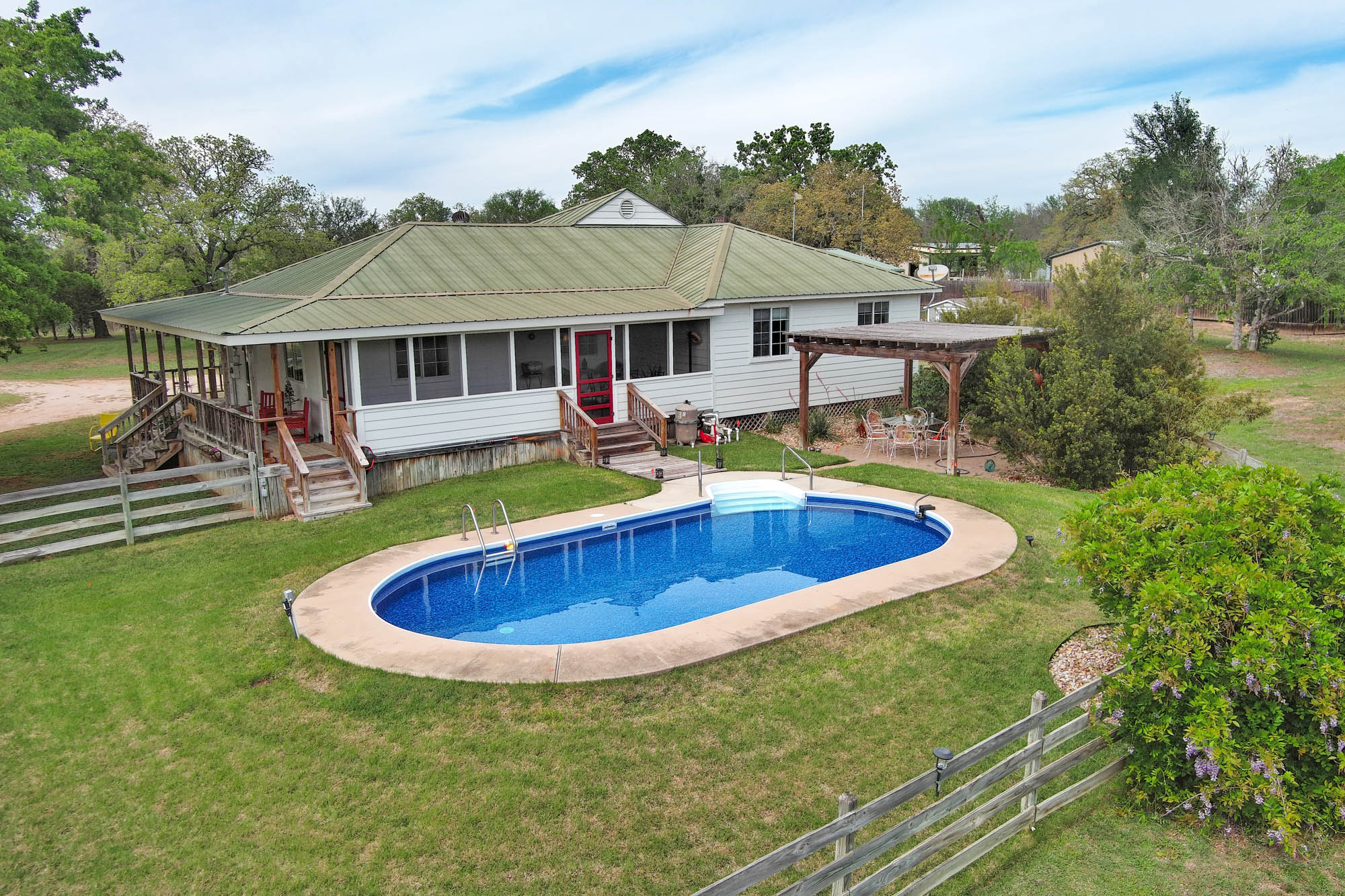 Back of house with pool view.
