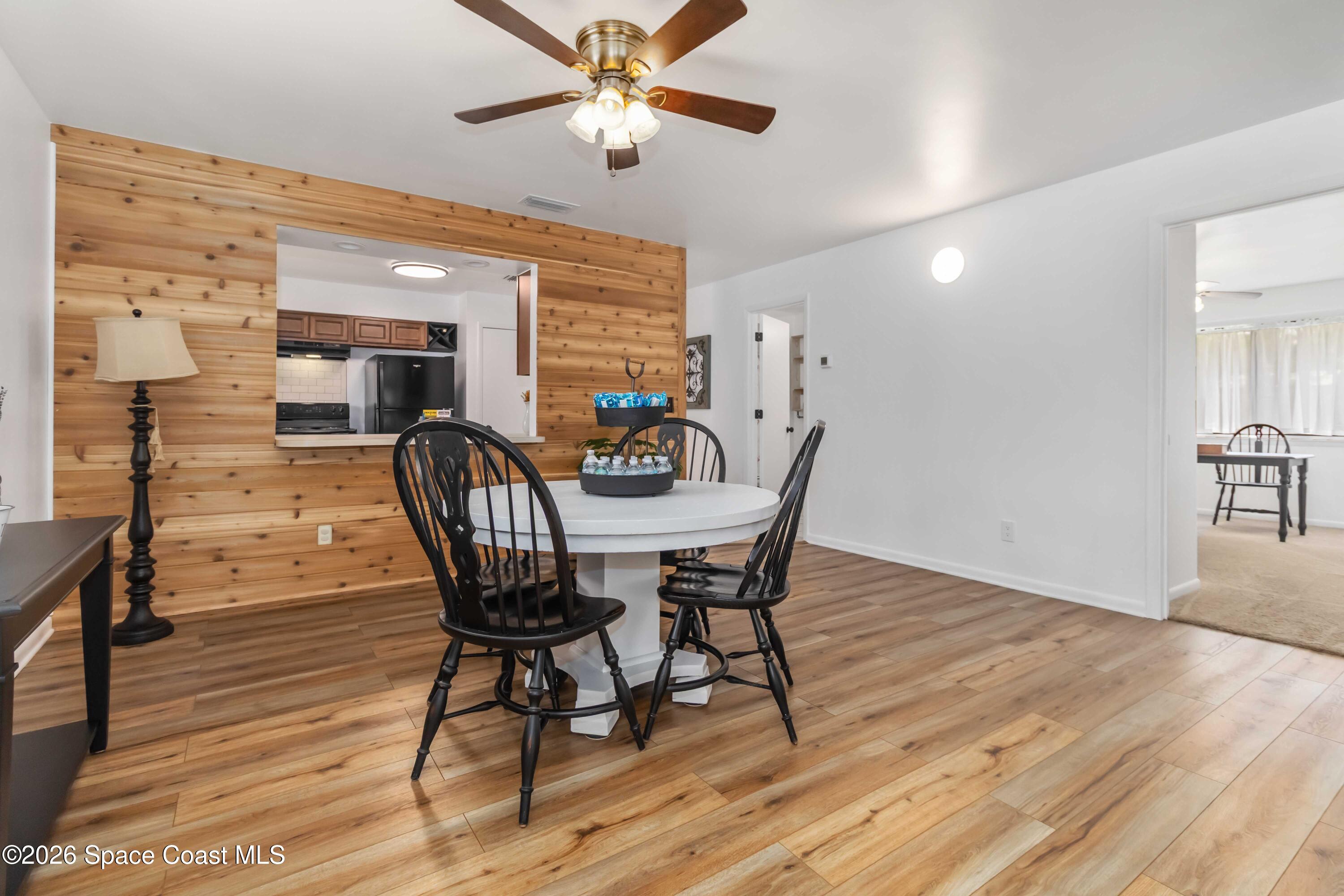 21 Branch Street Melbourne, FL 32901 - Photo 13 of 30 a view of a dining room with furniture and wooden floor