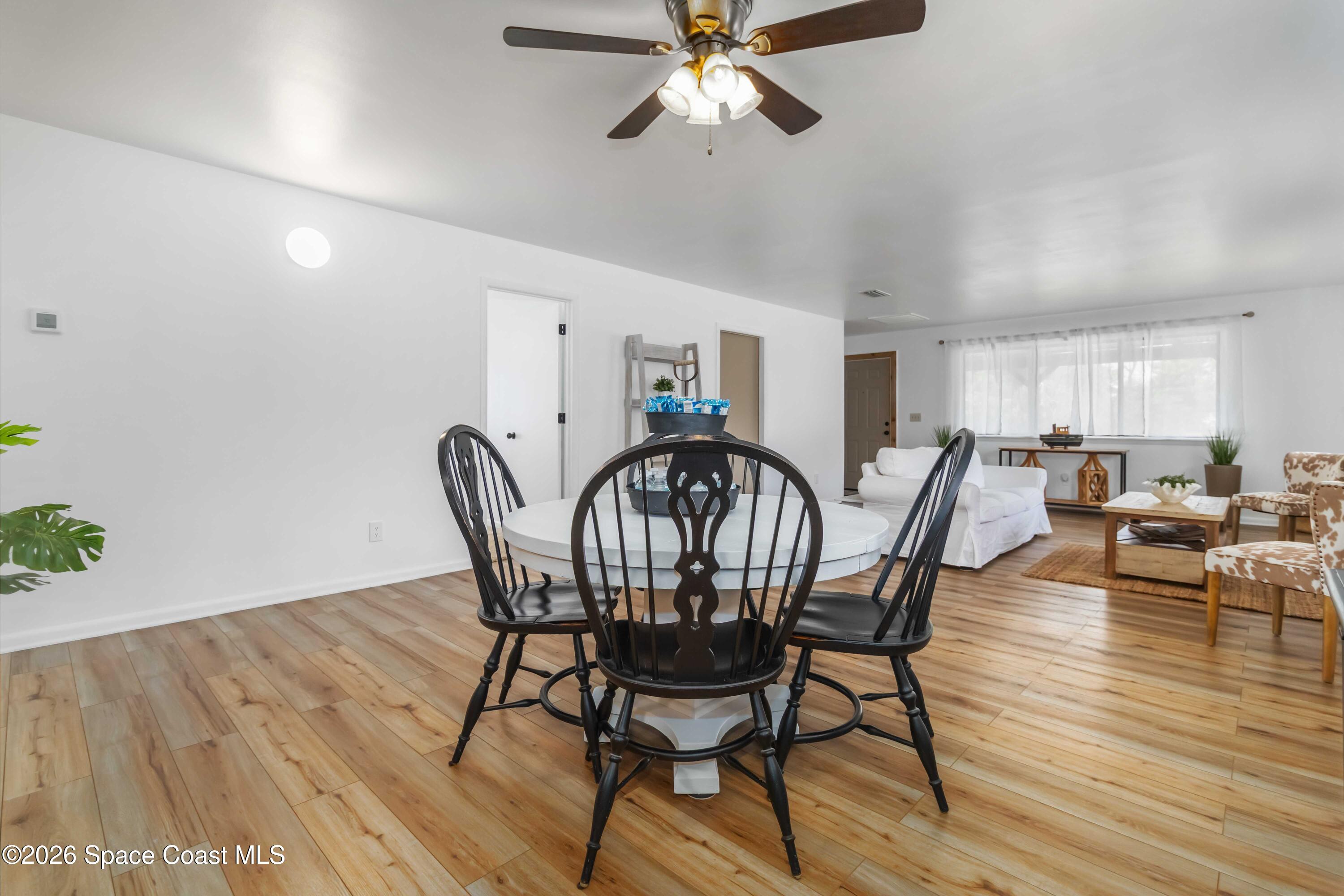 21 Branch Street Melbourne, FL 32901 - Photo 14 of 30 a view of a dining room with furniture and wooden floor