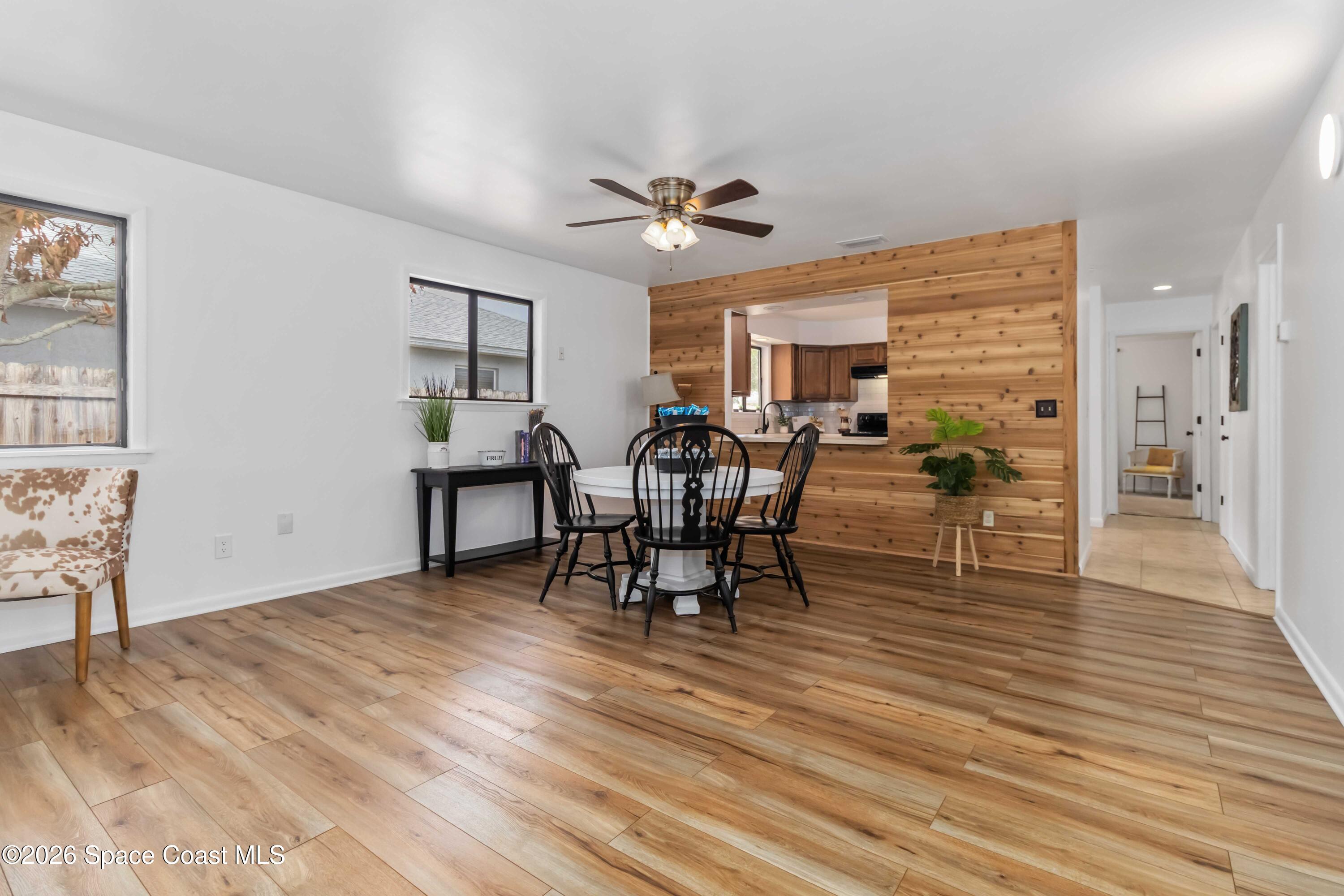 21 Branch Street Melbourne, FL 32901 - Photo 15 of 30 a view of a dining room with furniture and wooden floor