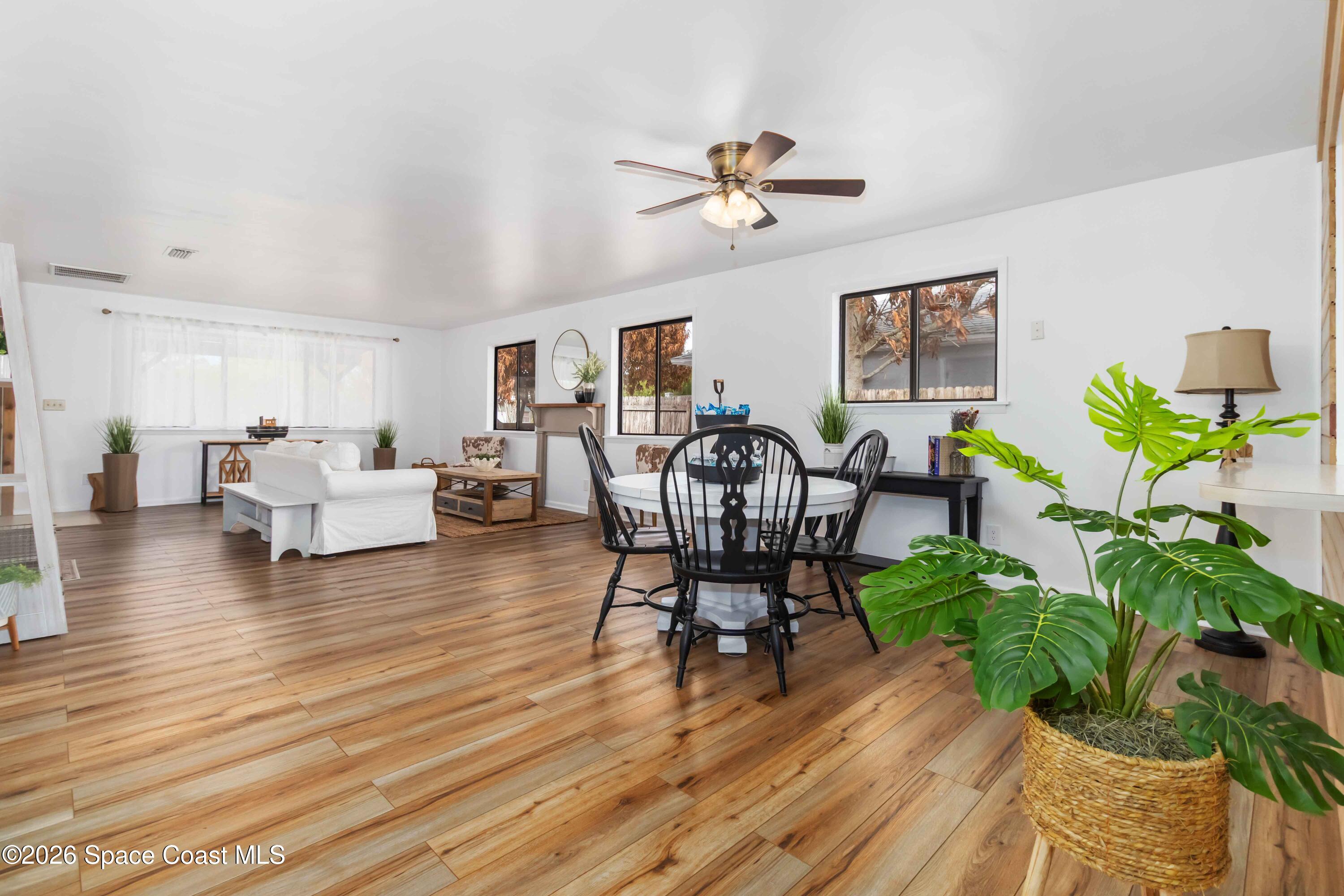 21 Branch Street Melbourne, FL 32901 - Photo 16 of 30 a living room with furniture and a wooden floor