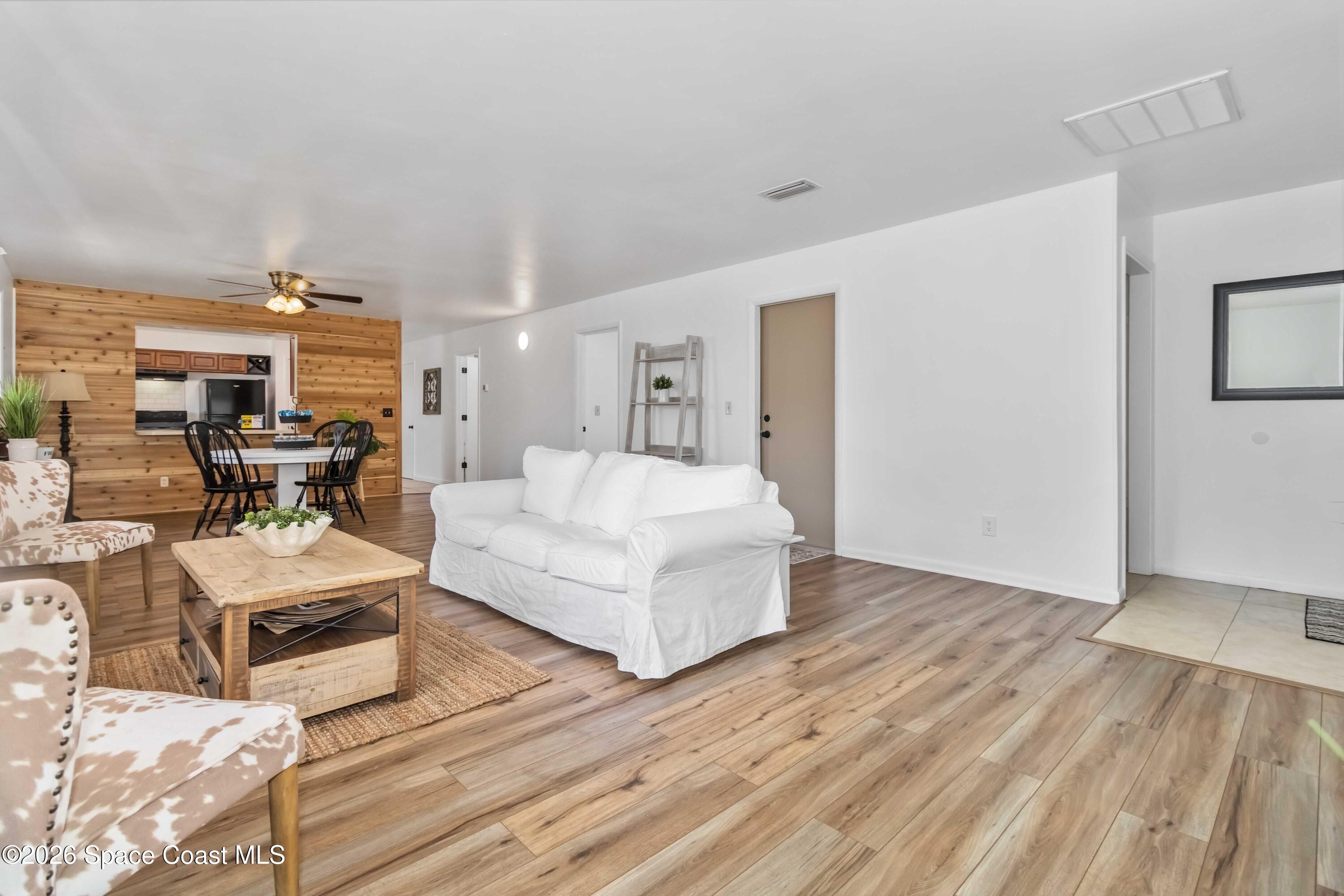 21 Branch Street Melbourne, FL 32901 - Photo 17 of 30 a living room with furniture and a wooden floor