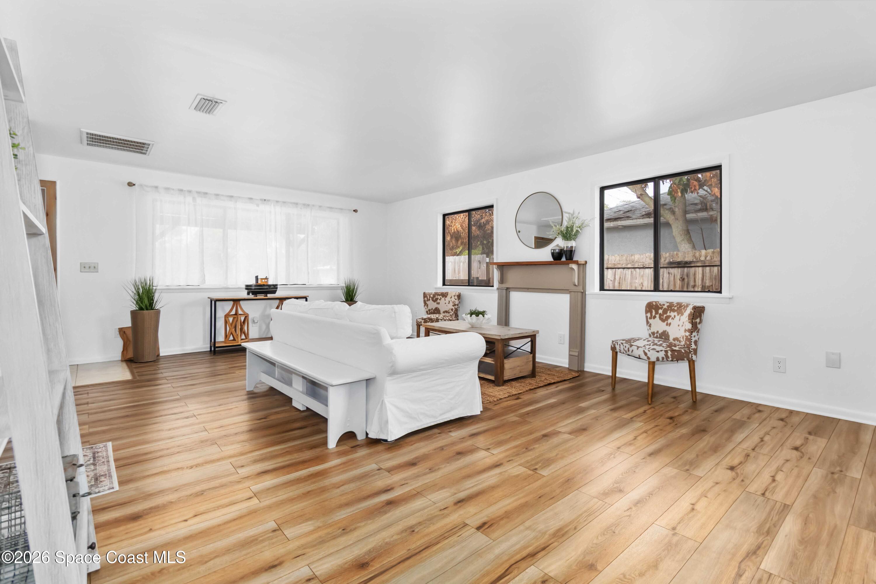 21 Branch Street Melbourne, FL 32901 - Photo 19 of 30 a living room with furniture and a wooden floor