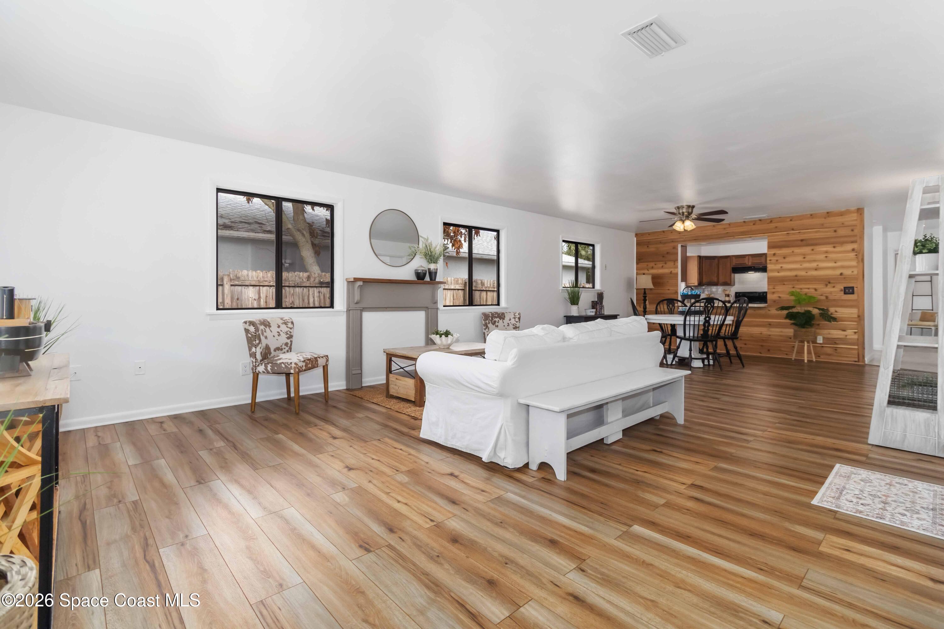 21 Branch Street Melbourne, FL 32901 - Photo 20 of 30 a living room with furniture and wooden floor