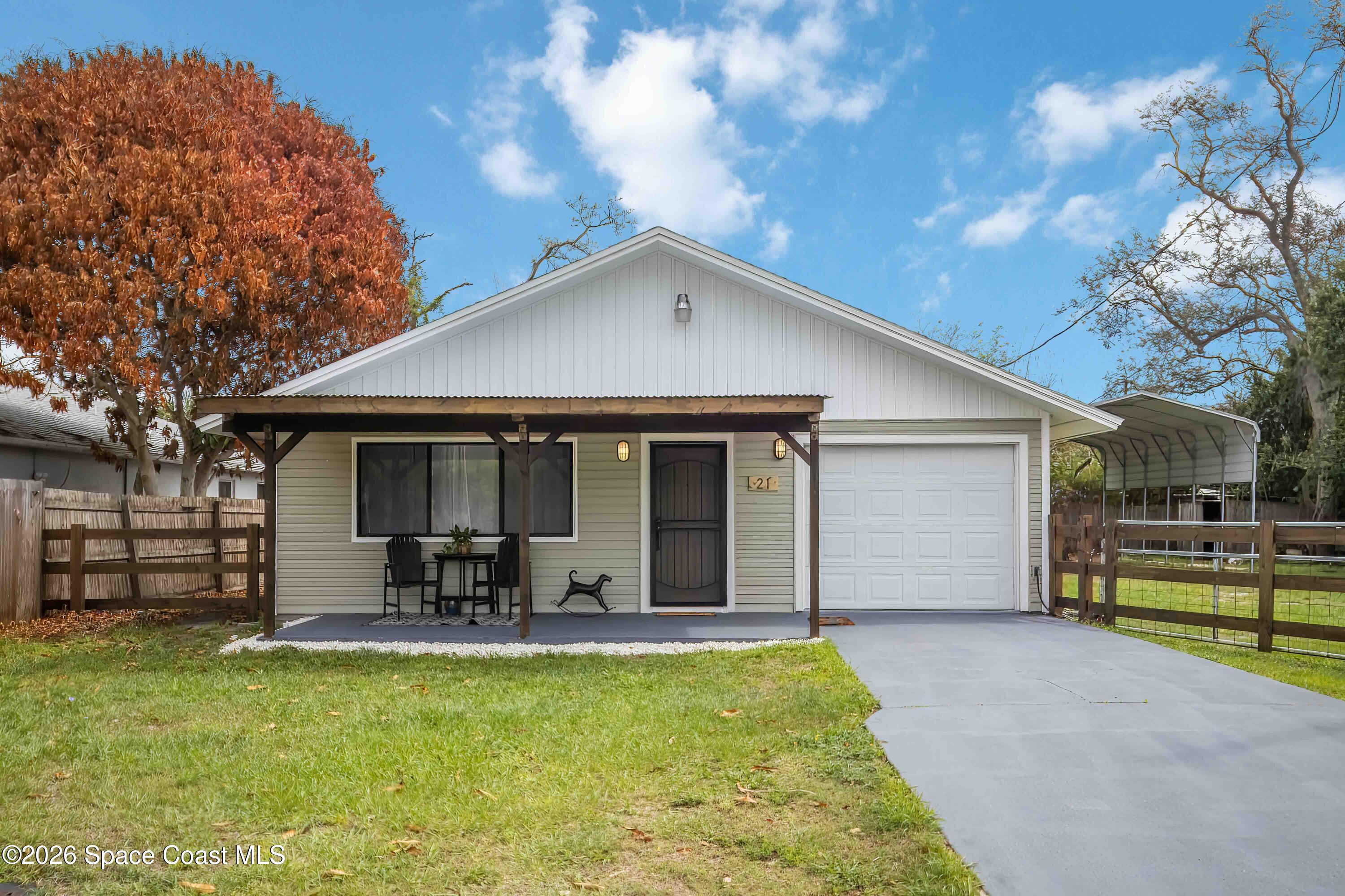 21 Branch Street Melbourne, FL 32901 - Photo 2 of 30 a front view of house with yard and outdoor seating
