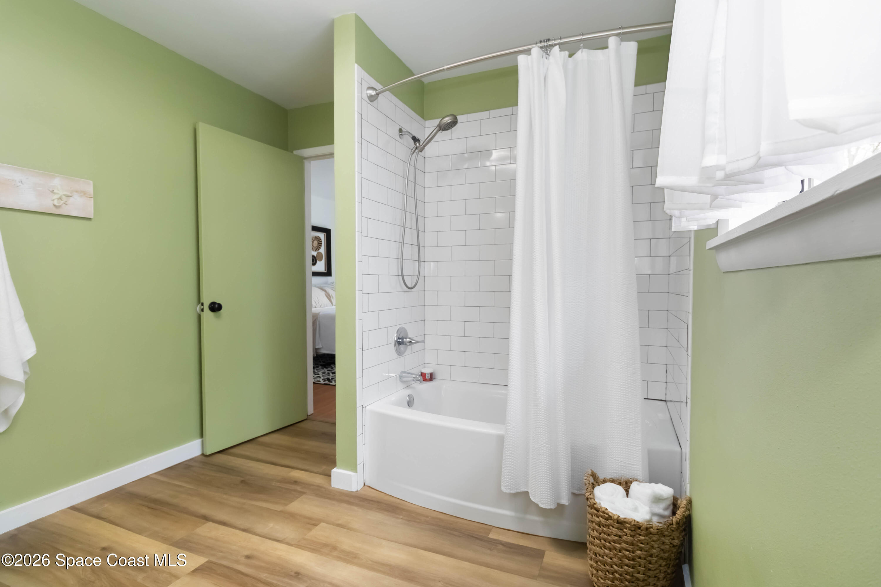 21 Branch Street Melbourne, FL 32901 - Photo 24 of 30 a bathroom with a bathtub and shower