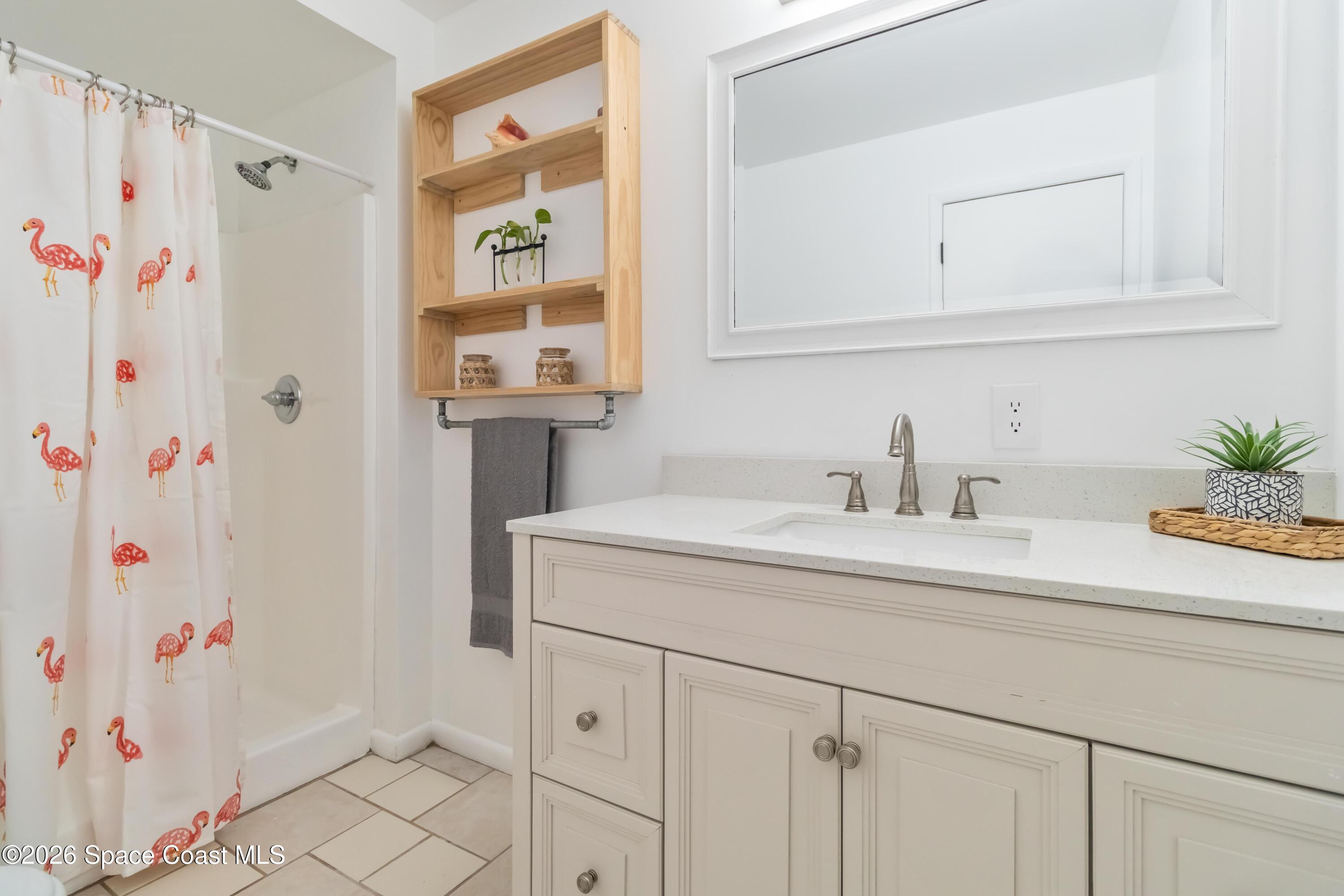 21 Branch Street Melbourne, FL 32901 - Photo 28 of 30 a bathroom with a sink and a mirror