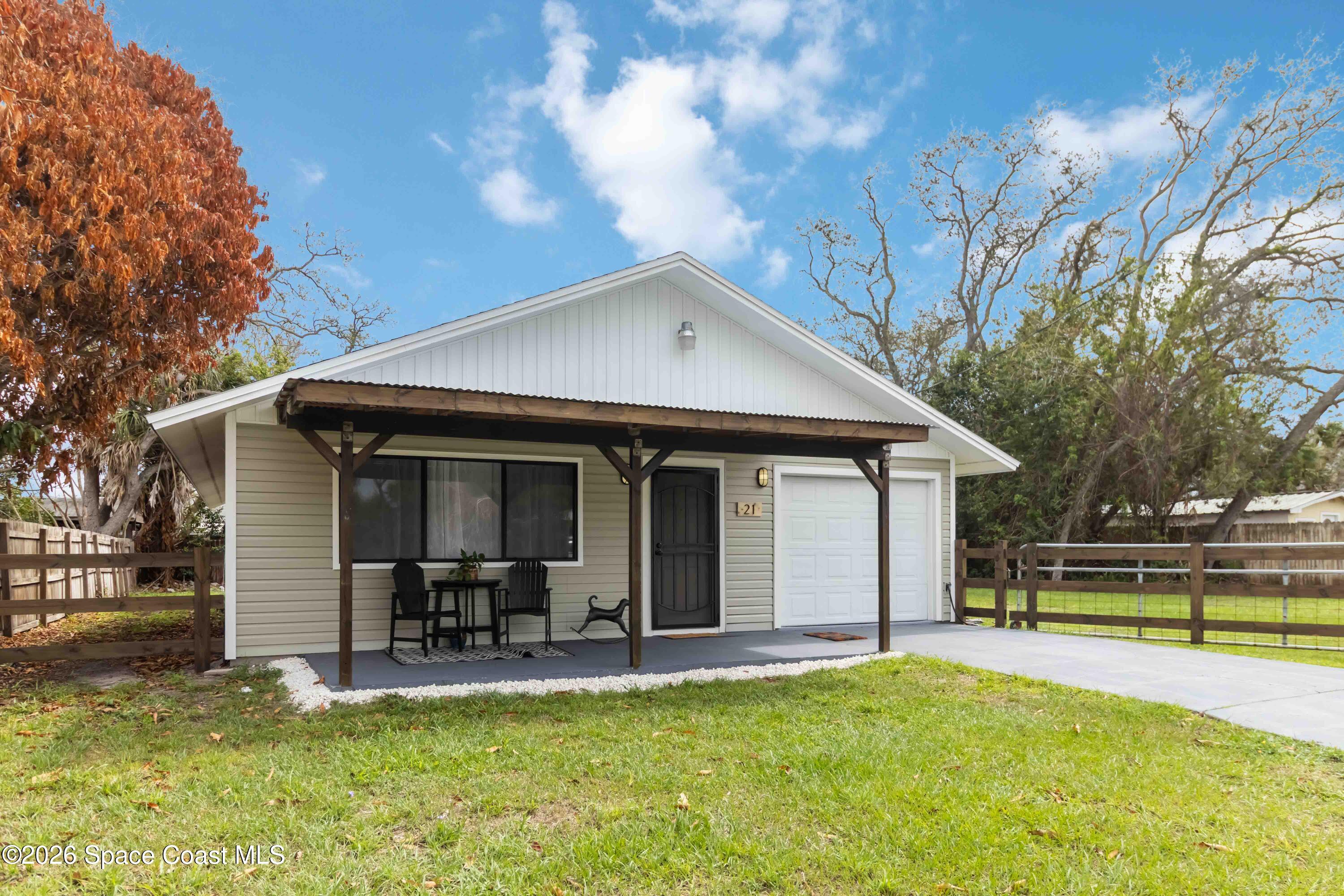 21 Branch Street Melbourne, FL 32901 - Photo 3 of 30 a view of a house with pool and a yard