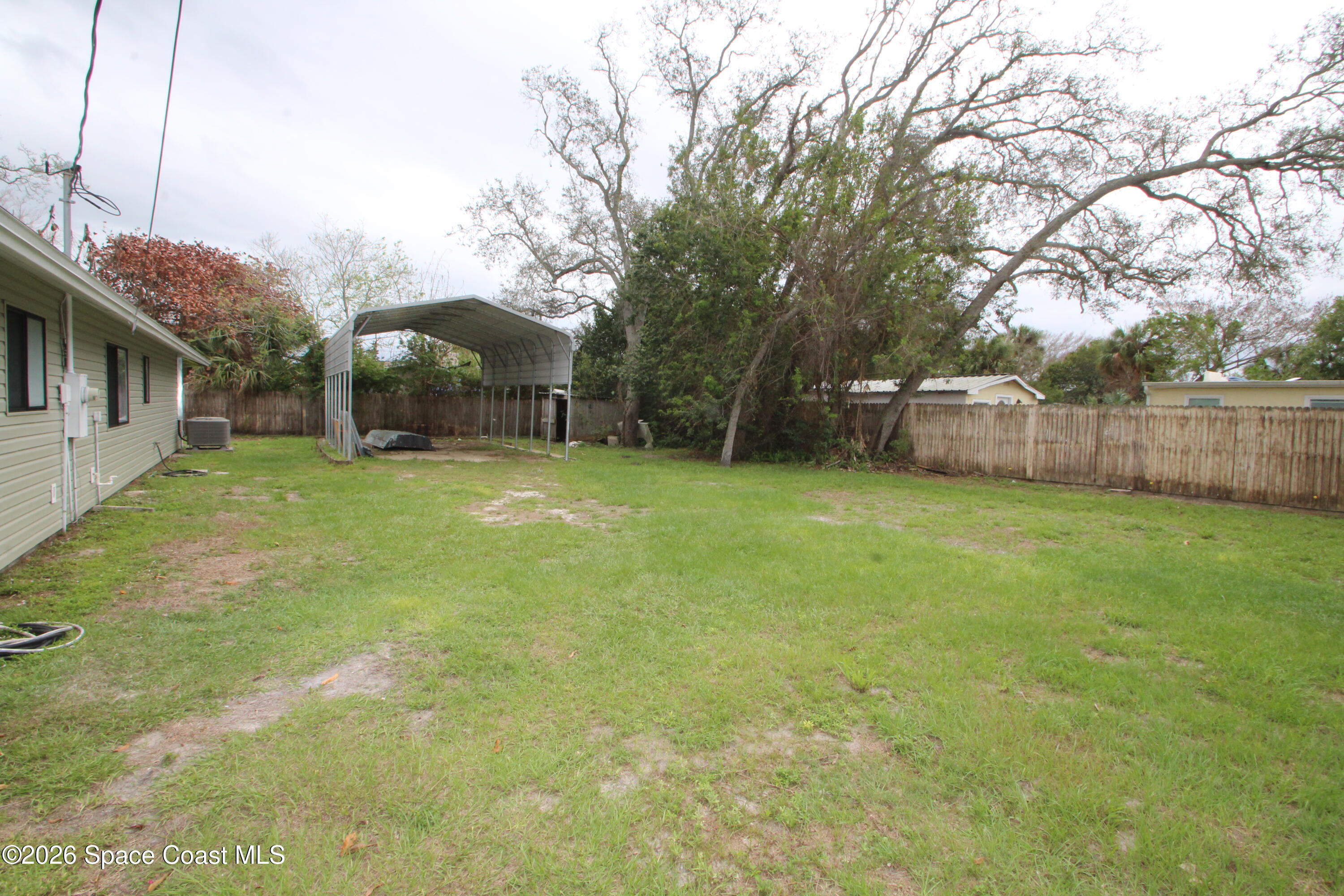 21 Branch Street Melbourne, FL 32901 - Photo 7 of 30 a view of a backyard with a small cabin