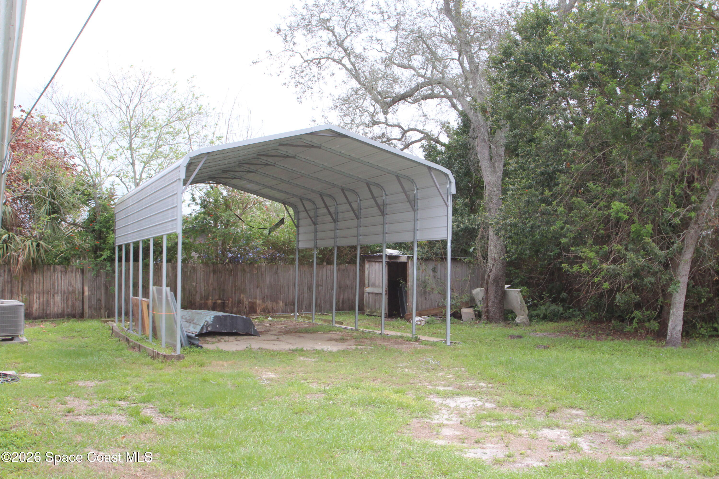 21 Branch Street Melbourne, FL 32901 - Photo 9 of 30 a backyard of a house with barbeque oven