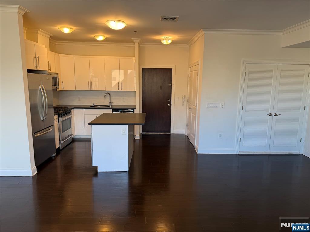 2001 Hudson Terrace, Unit 501 Fort Lee, NJ 07024 - Photo 1 of 23 a kitchen with a refrigerator and a stove top oven