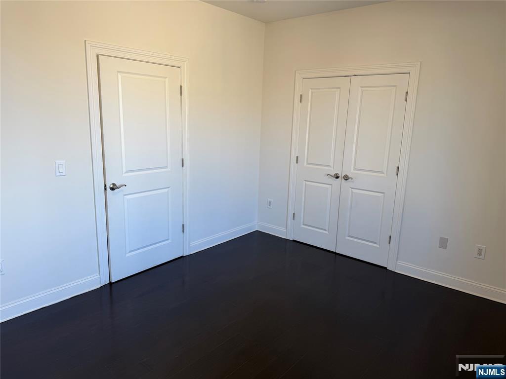 2001 Hudson Terrace, Unit 501 Fort Lee, NJ 07024 - Photo 14 of 23 an empty room with a door