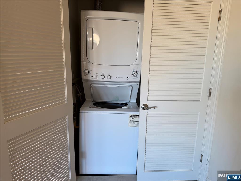 2001 Hudson Terrace, Unit 501 Fort Lee, NJ 07024 - Photo 18 of 23 a utility room with dryer and washer