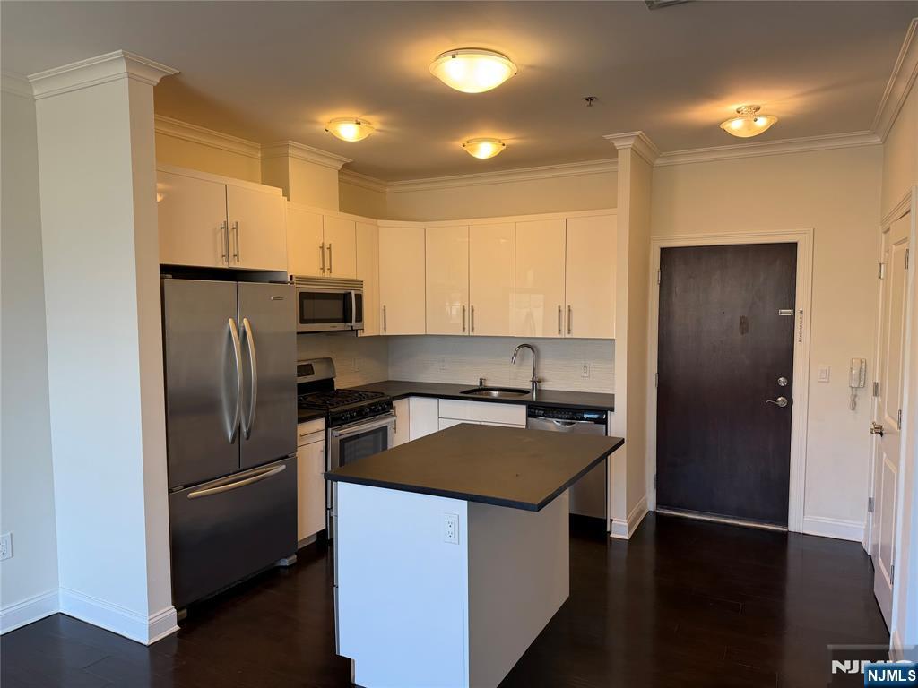 2001 Hudson Terrace, Unit 501 Fort Lee, NJ 07024 - Photo 3 of 23 a kitchen with a refrigerator a microwave a sink and a stove