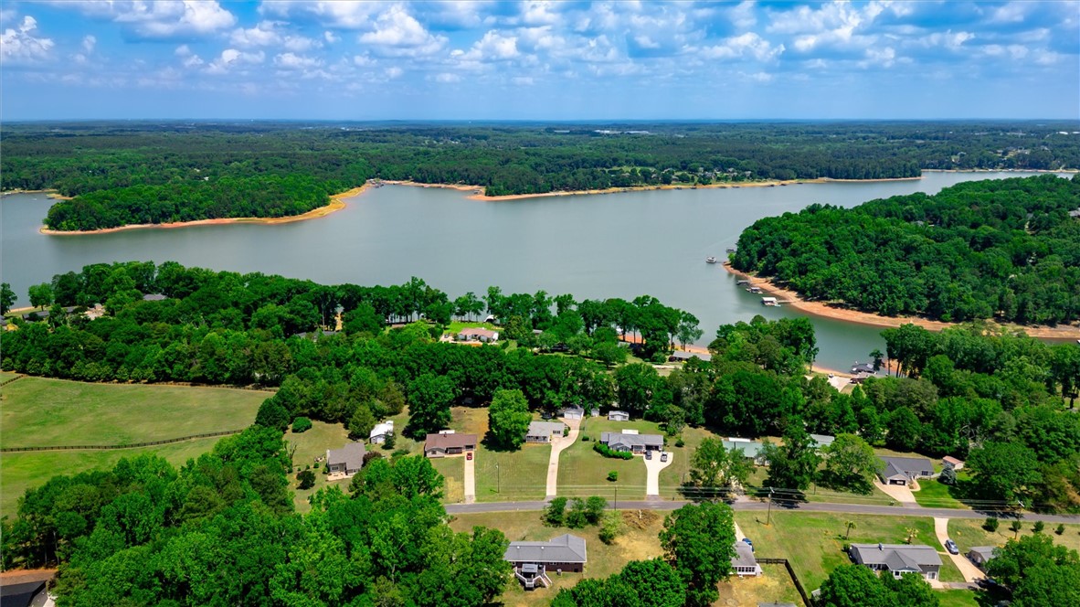 1815 Pearman Dairy Road Anderson, SC 29625 - Photo 35 of 35 An aerial perspective reveals a serene lakefront community nestled amidst lush, mature trees.