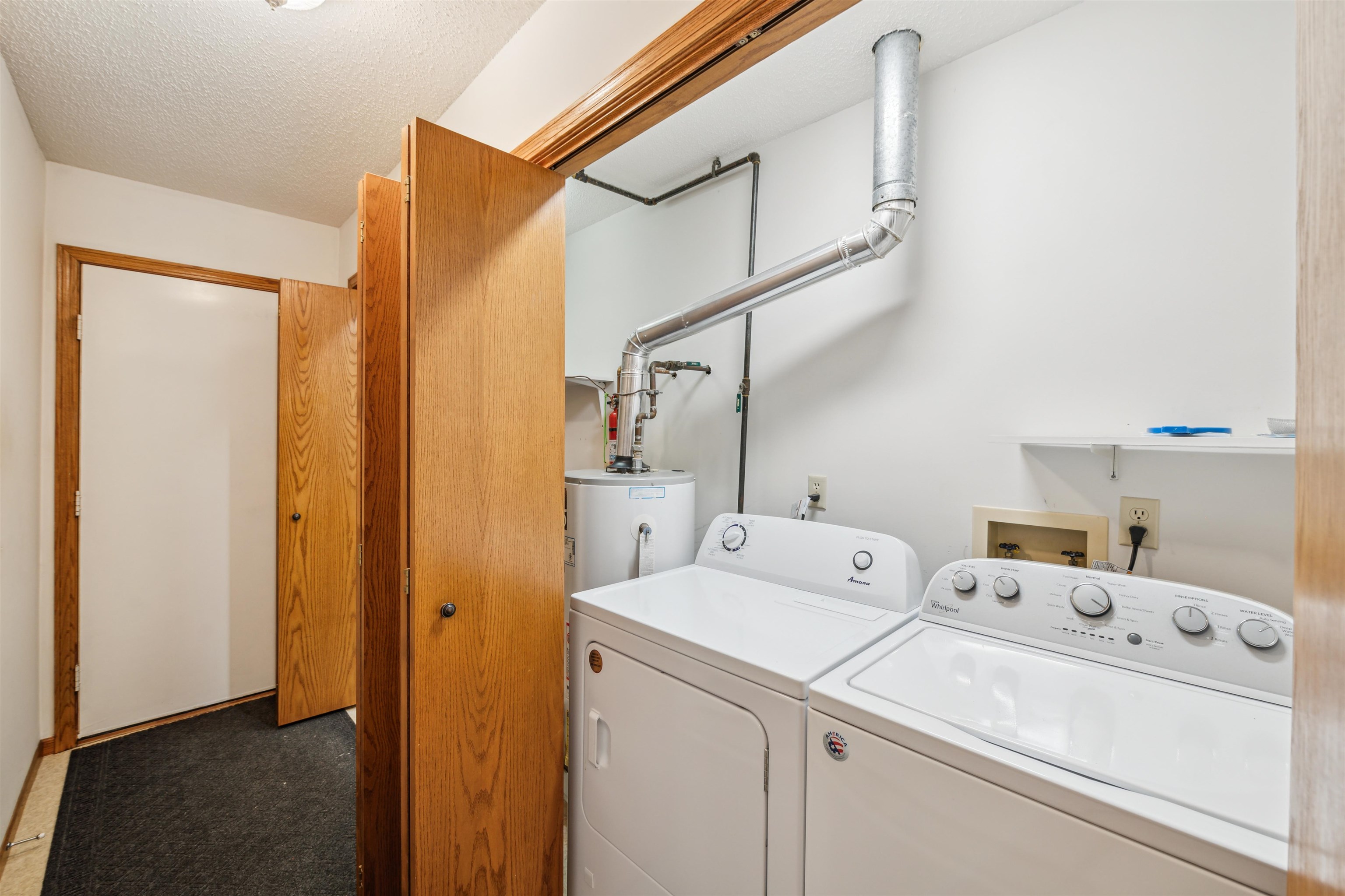 5948 Lavaque Road Duluth, MN 55803 - Photo 14 of 22 Washroom with independent washer and dryer, a textured ceiling, and carpet flooring