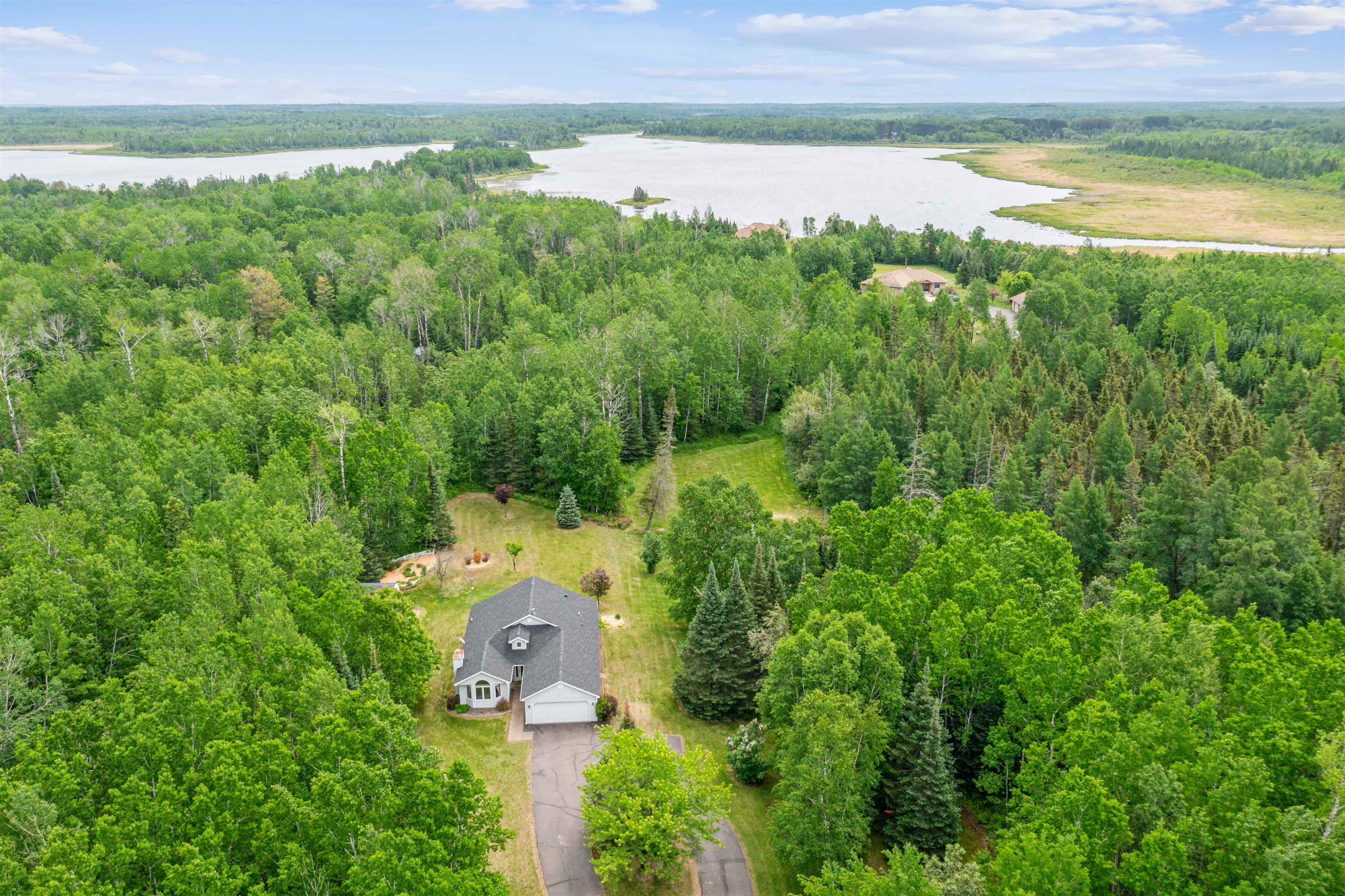 5948 Lavaque Road Duluth, MN 55803 - Photo 20 of 22 View of subject property featuring a large body of water and a heavily wooded area