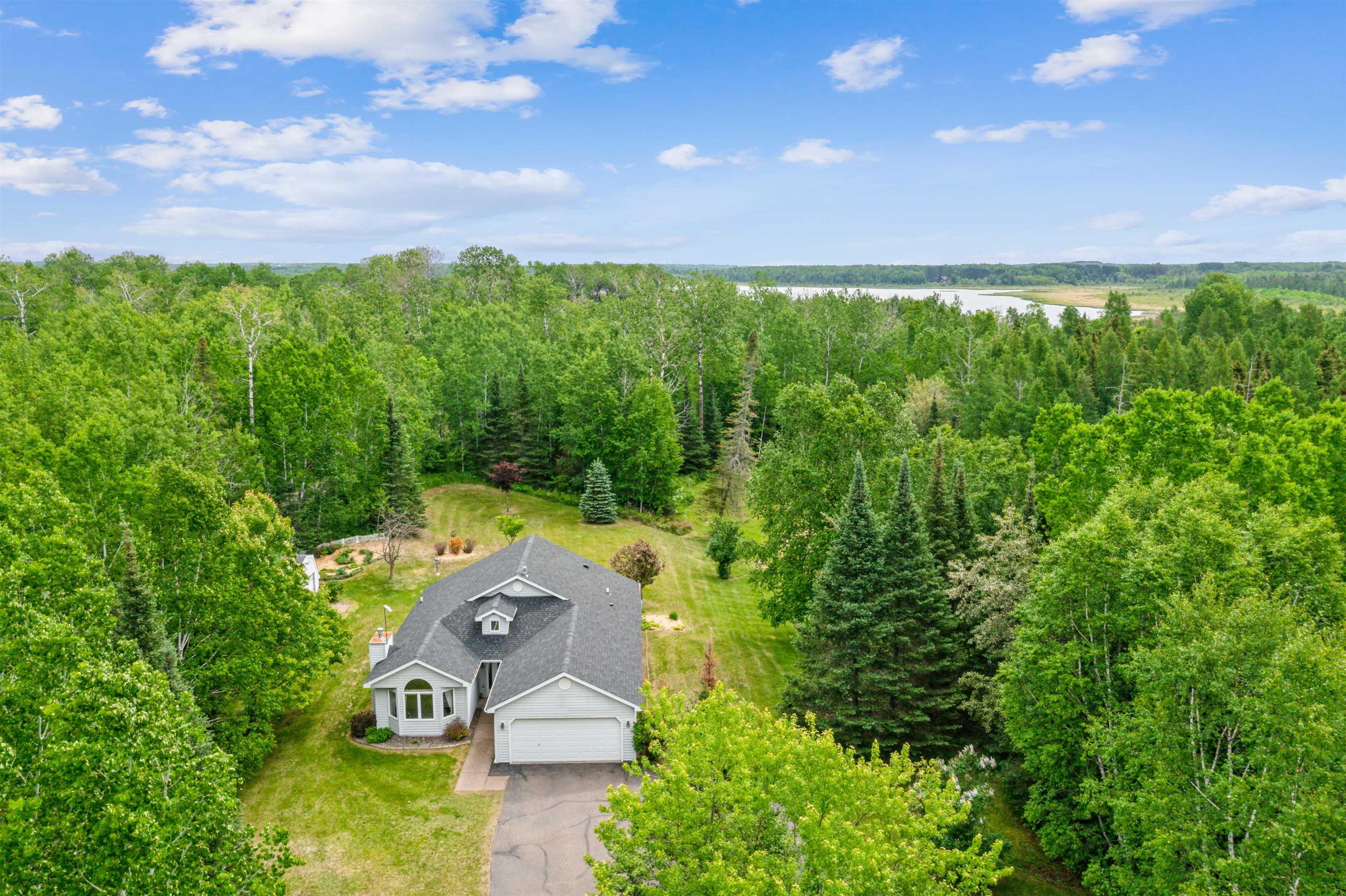 5948 Lavaque Road Duluth, MN 55803 - Photo 2 of 22 View from above of property with a forest and a nearby body of water