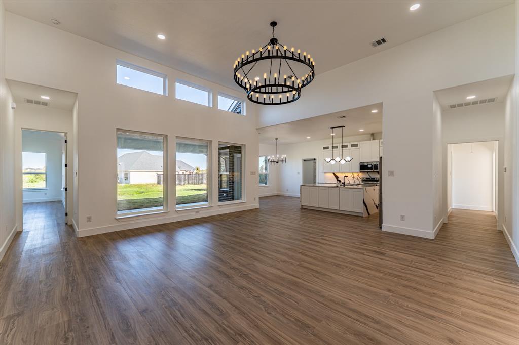 2147 Heath Street Sulphur Springs, TX 75482 - Photo 2 of 40 a view of an empty room and window with wooden floor