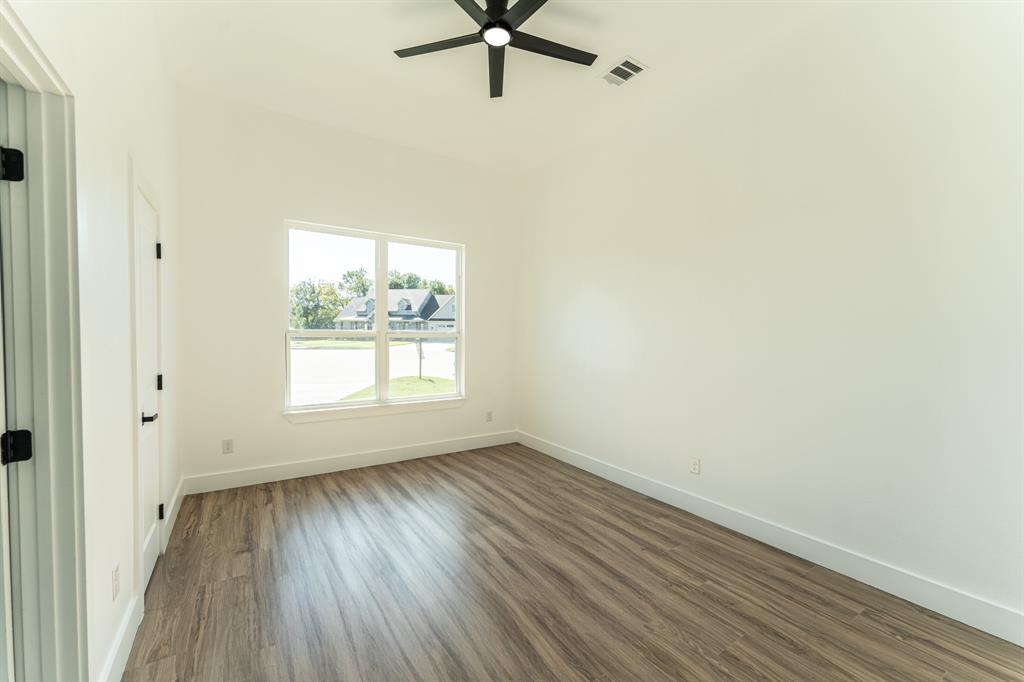 2147 Heath Street Sulphur Springs, TX 75482 - Photo 24 of 40 wooden floor in an empty room with a window