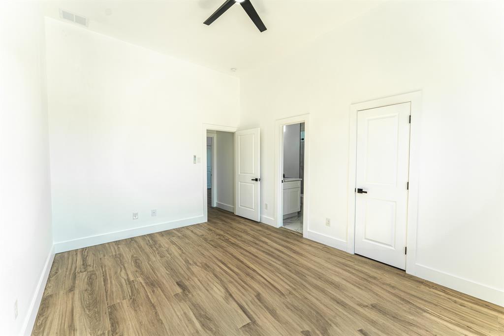 2147 Heath Street Sulphur Springs, TX 75482 - Photo 25 of 40 a view of an empty room with wooden floor